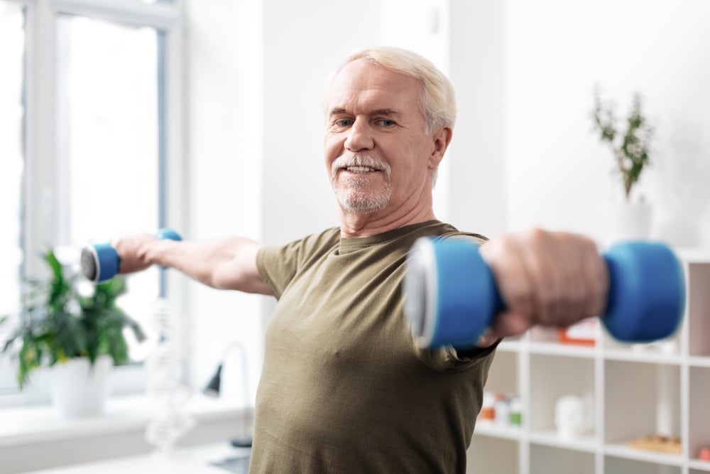 Strong man in his late 50s benefits from peptide therapy. Strong man in his late 50s benefits from peptide therapy.